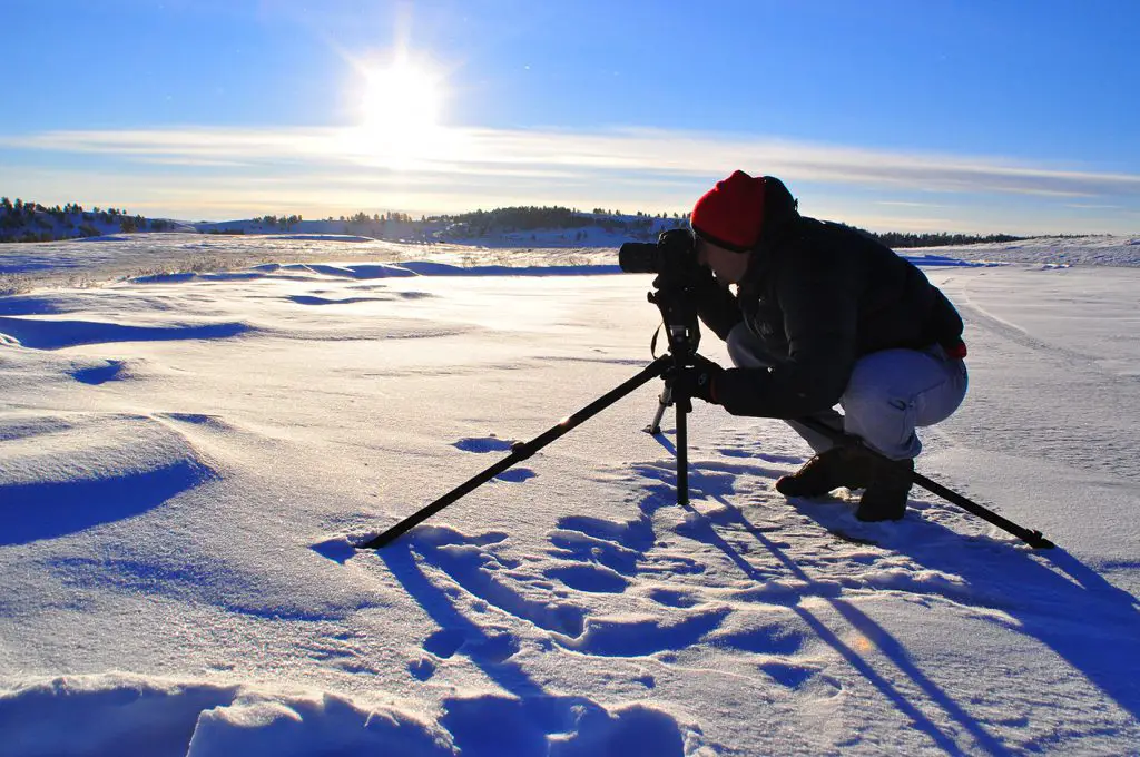 Photographe en action durant voyage aux Etats-Unis