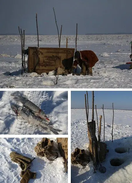 Nouvelle rencontre avec un pêcheur autochtone. Equipement rudimentaire. Tapis, drap ou bâche plastique ou encore cartons, tendus sur des piquets de bois servent à se protéger du vent durant le voyage à vélo sur le fleuve Amour en Sibérie 