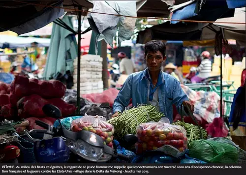 #Fierté - Au milieu des fruits et légumes, le regard de ce jeune homme me rappelle que les Vietnamiens ont traversé 1000 ans d'occupation chinoise, la colonisation française et la guerre contre les Etats-Unis - village dans le Delta du Mékong - Jeudi 2 mai 2013